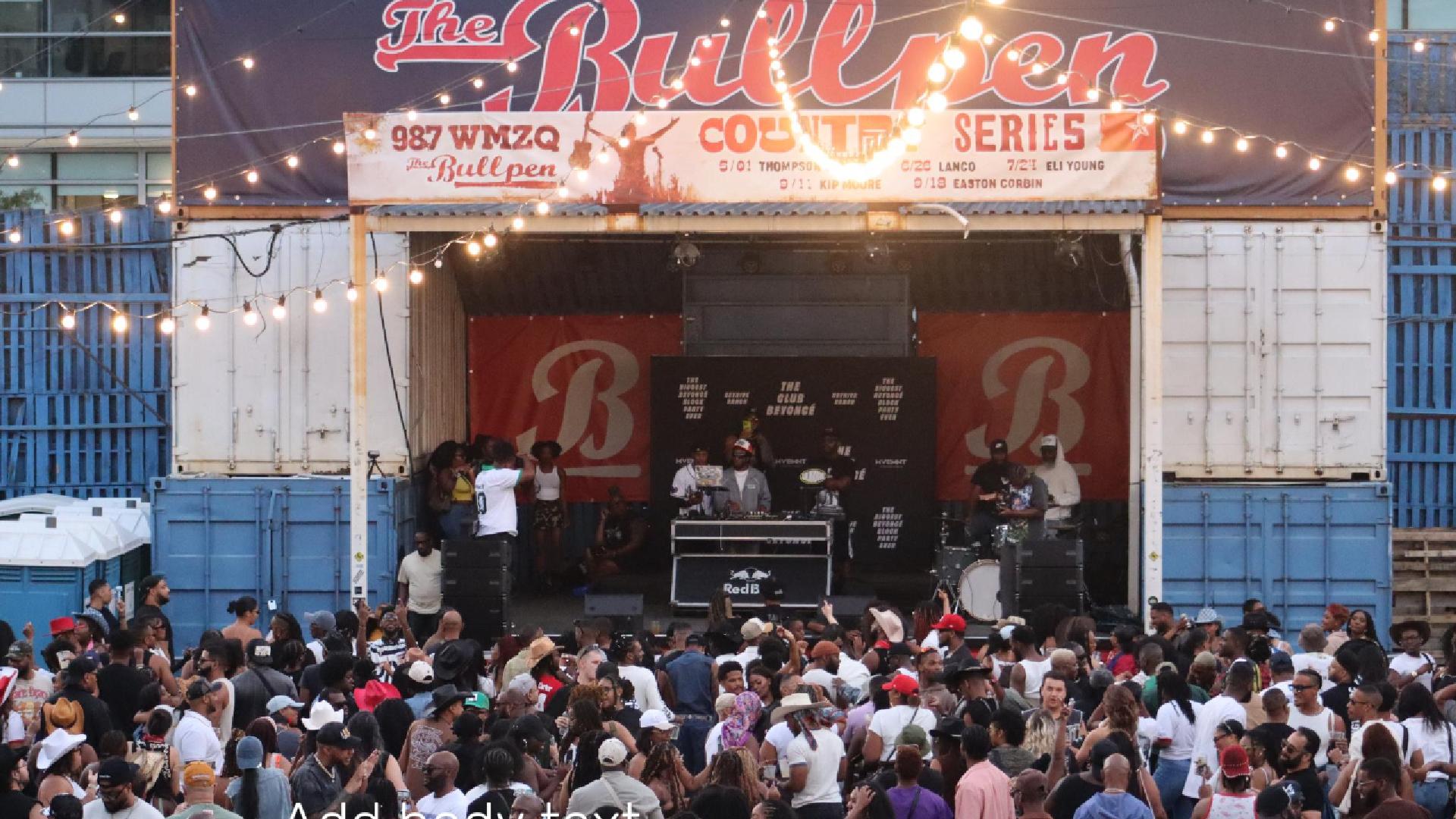 Outdoor concert event with a stage and 'The Bullpen' branding.